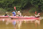 Travellers kayaking on the Nam Ou river near Luang Prabang